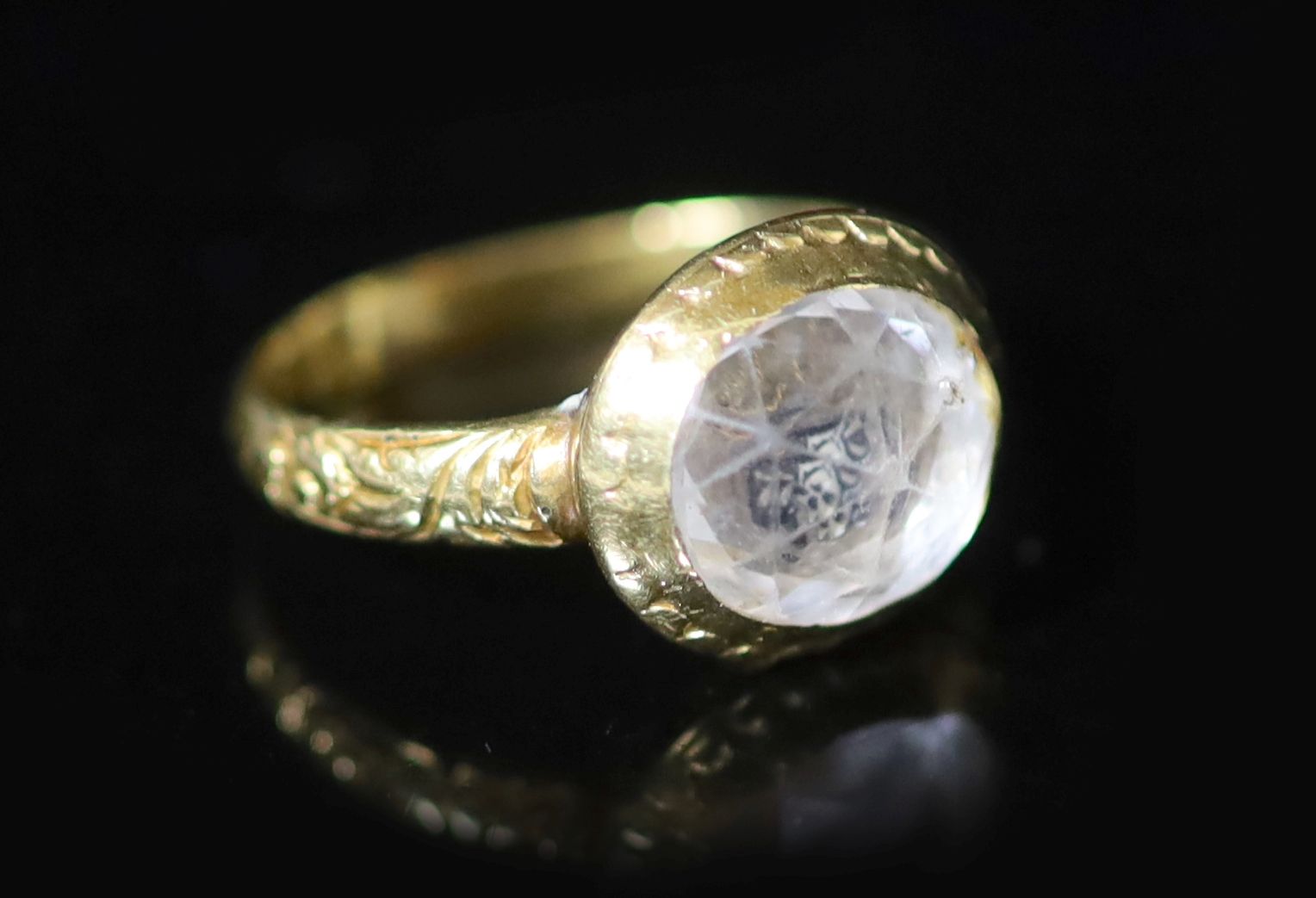 An early George I engraved gold, rock crystal and two colour enamel set memento mori ring